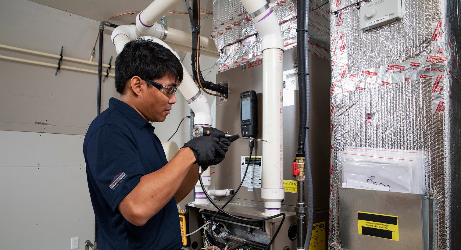 Horizon technician working on a heating and cooling system