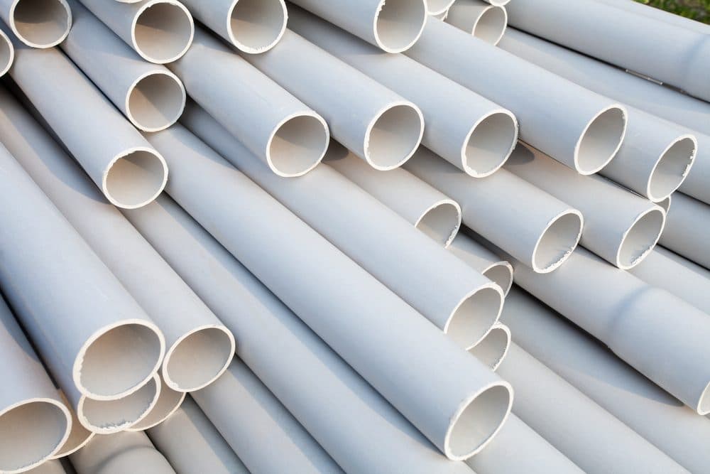 A bundle of older white polybutylene pipes