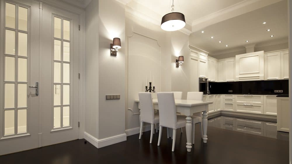 Wall sconces in a combined kitchen and dining room