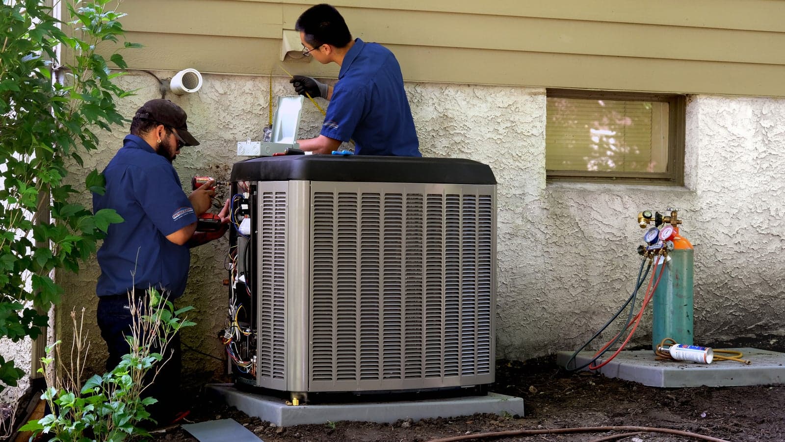 Horizon Services technicians installing a new central air conditioning system