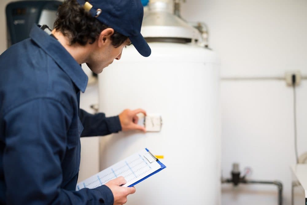 A Horizon technician inspecting a water heater