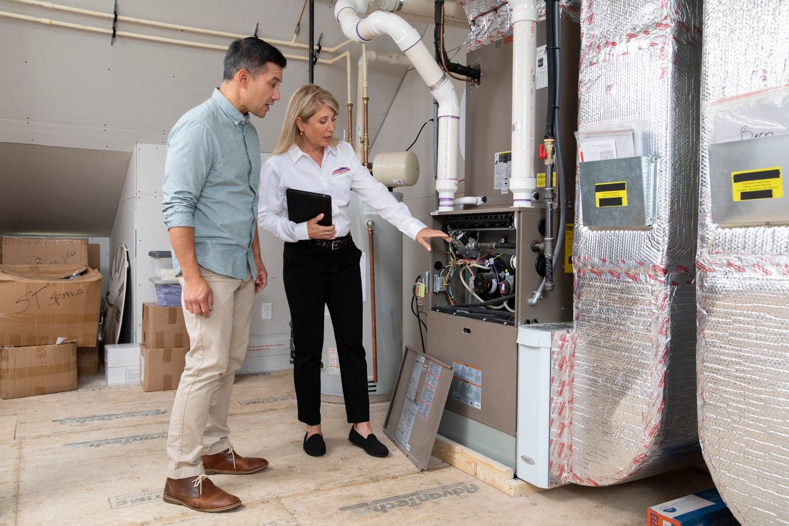 A Horizon Services comfort consultant reviewing equipment options with homeowners