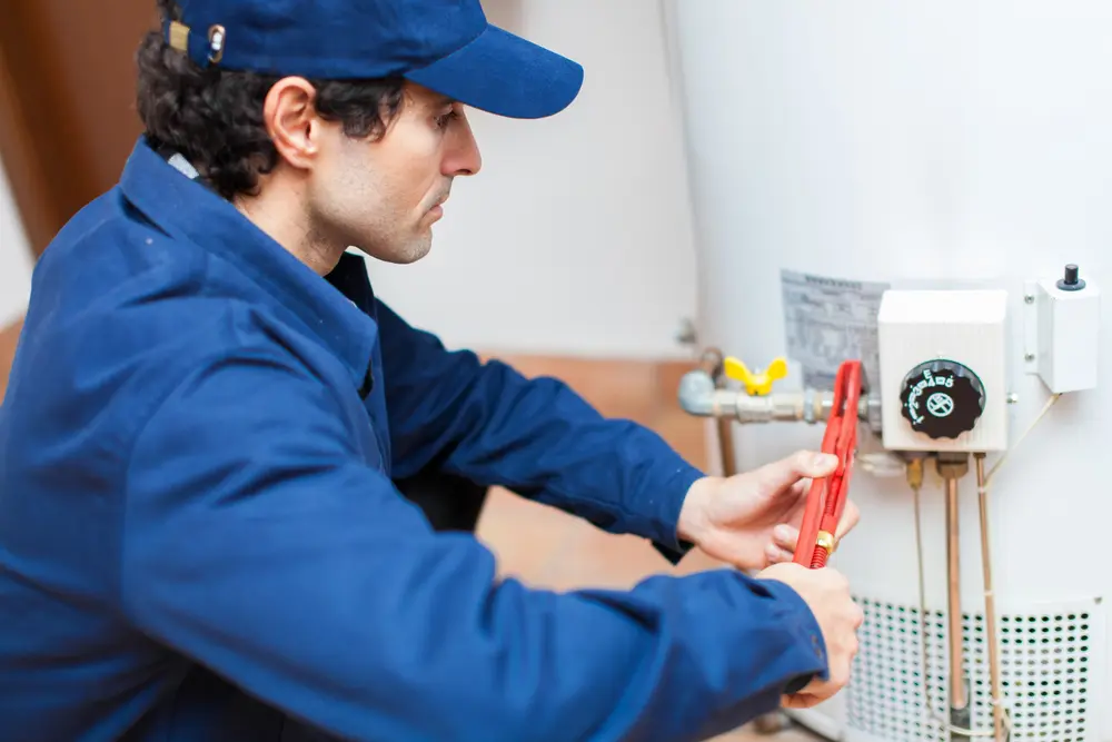 Horizon technician making repairs on a water heater