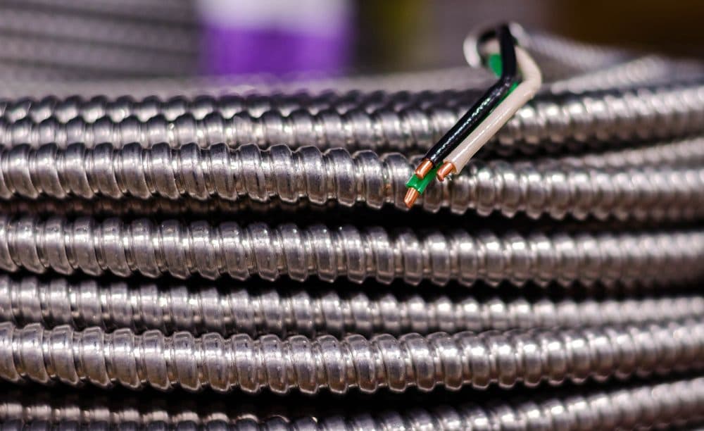 A spool of metal clad wire with the ends opened