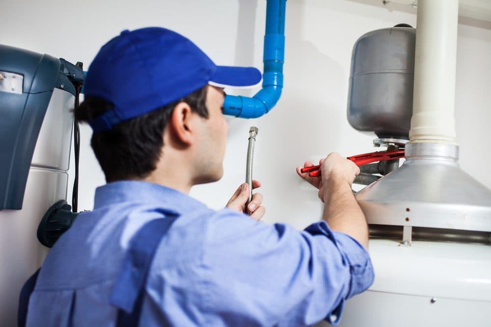 Horizon technician adjusting a connection with a wrench