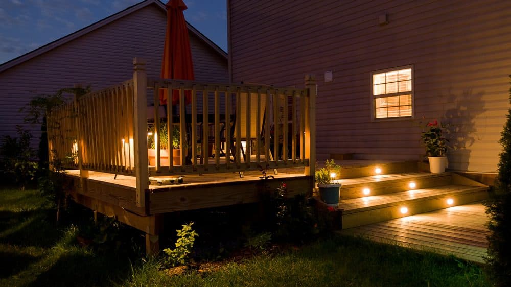 A back deck with step lighting and highlights to make it easy to enjoy